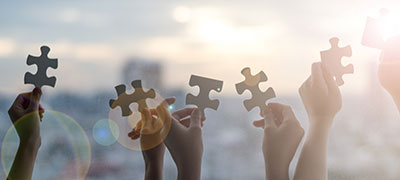 iStock-1132265686-ESOP-puzzle-pieces-held-by-hands-horizontal-panoramic iStock-1132265686-ESOP-puzzle-pieces-held-by-hands-horizontal-panoramic